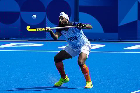 Jarmanpreet Singh stops the ball during match against Argentina